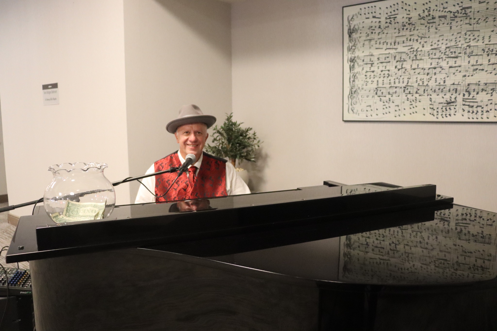 David Scott Brown smiling at the piano during a live performance